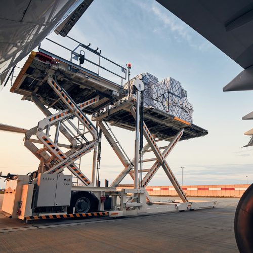 g1 Preparation before flight. Loading of cargo containers to airplane at airport.; Shutterstock ID 1797435868; other: -; purchase_order: -; client: -; job: -