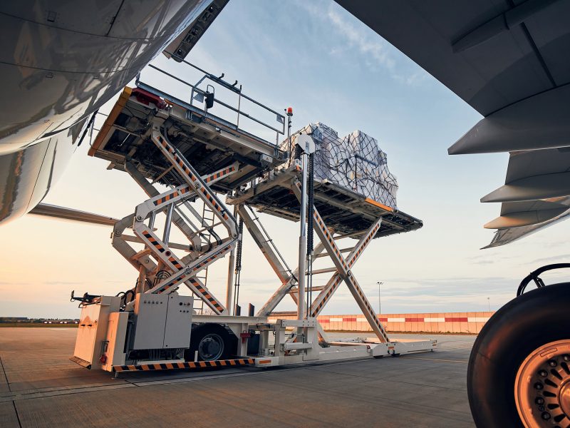 g1 Preparation before flight. Loading of cargo containers to airplane at airport.; Shutterstock ID 1797435868; other: -; purchase_order: -; client: -; job: -