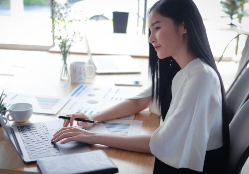 Asian,Business,Woman,Working,In,In,Coffee,Shop,Cafe,With Asian business woman working in in coffee shop cafe with laptop paper work (Business woman concept.)